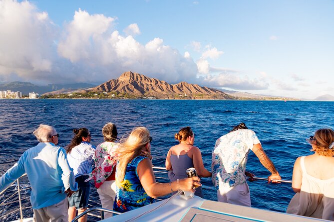 Board from Waikiki Beach for a scenic Sunset Sail on the Hāwea - Boarding From the Beach: Shoes Off, Water On