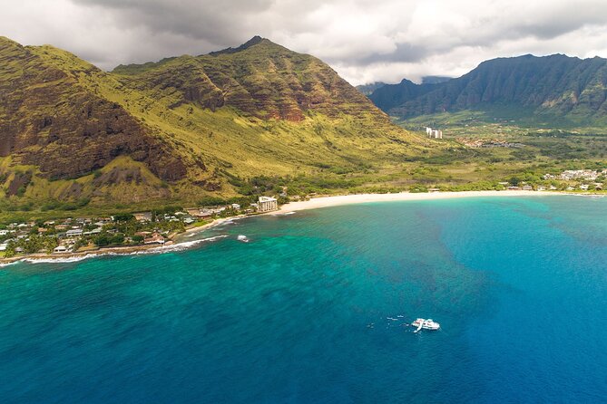 Oahu Dolphin and Snorkel Tour with Waikiki Pickup & Lunch - Stop 1: Dolphin spotting in spinner-dolphin waters