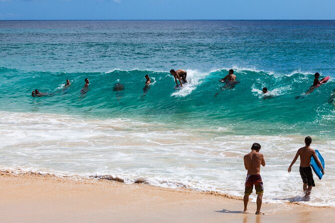 Oahu's Ultimate Grand Circle Island Tour with Snorkeling and More - Byodo-in Temple: calm gardens, a golden Buddha, and a small extra cost